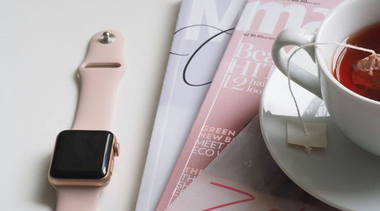 Apple Watch on Vintage Pink Silicone Strap with Magazines and Cup Of Tea